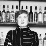 Profile image of a female stood in front of a drink bar