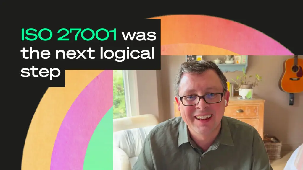 Smiling person on a video call with colourful abstract background and overlay text reading “ISO 27001 was the logical next step"
